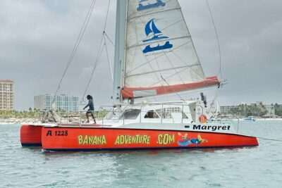 Banana Adventure Catamaran Tropical Sunset Sail - Shipwrecks, lighthouse views, and beachfront homes before the sun drops