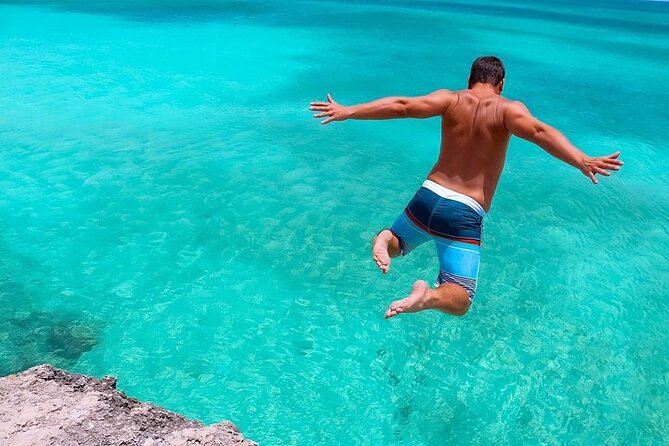 Colorful Beach Bus Sightseeing Tour of Aruba - Natural Bridge Aruba: volcanic limestone and big-wave north coast vibes