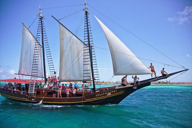 Set Sail in Aruba: Jolly Pirate Cruise with Snorkel Adventure - Onboard life: BBQ lunch, unlimited drinks, and the rope swing factor
